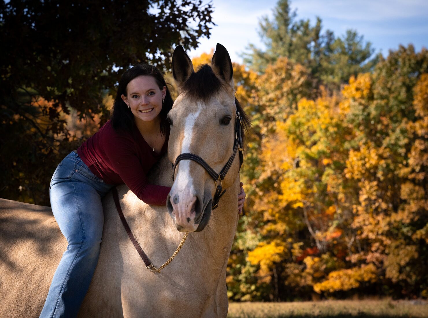 Cassie with a dog and horse outdoors