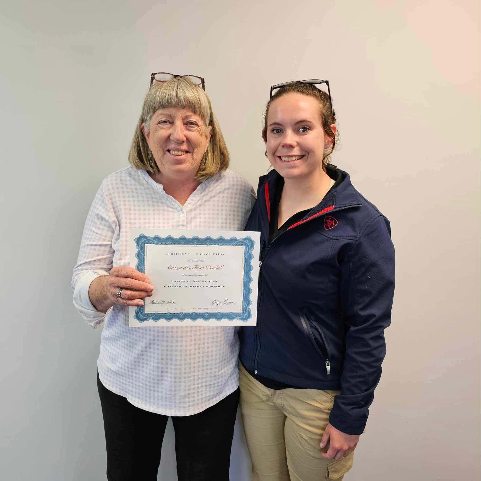 Cassie Kendall holding a training certificate