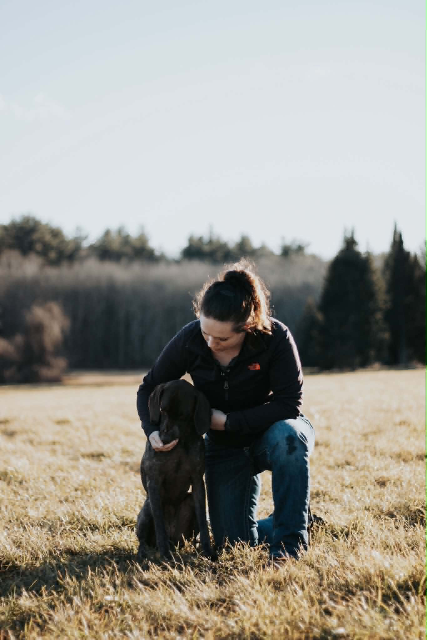 Cassie training a dog outdoors